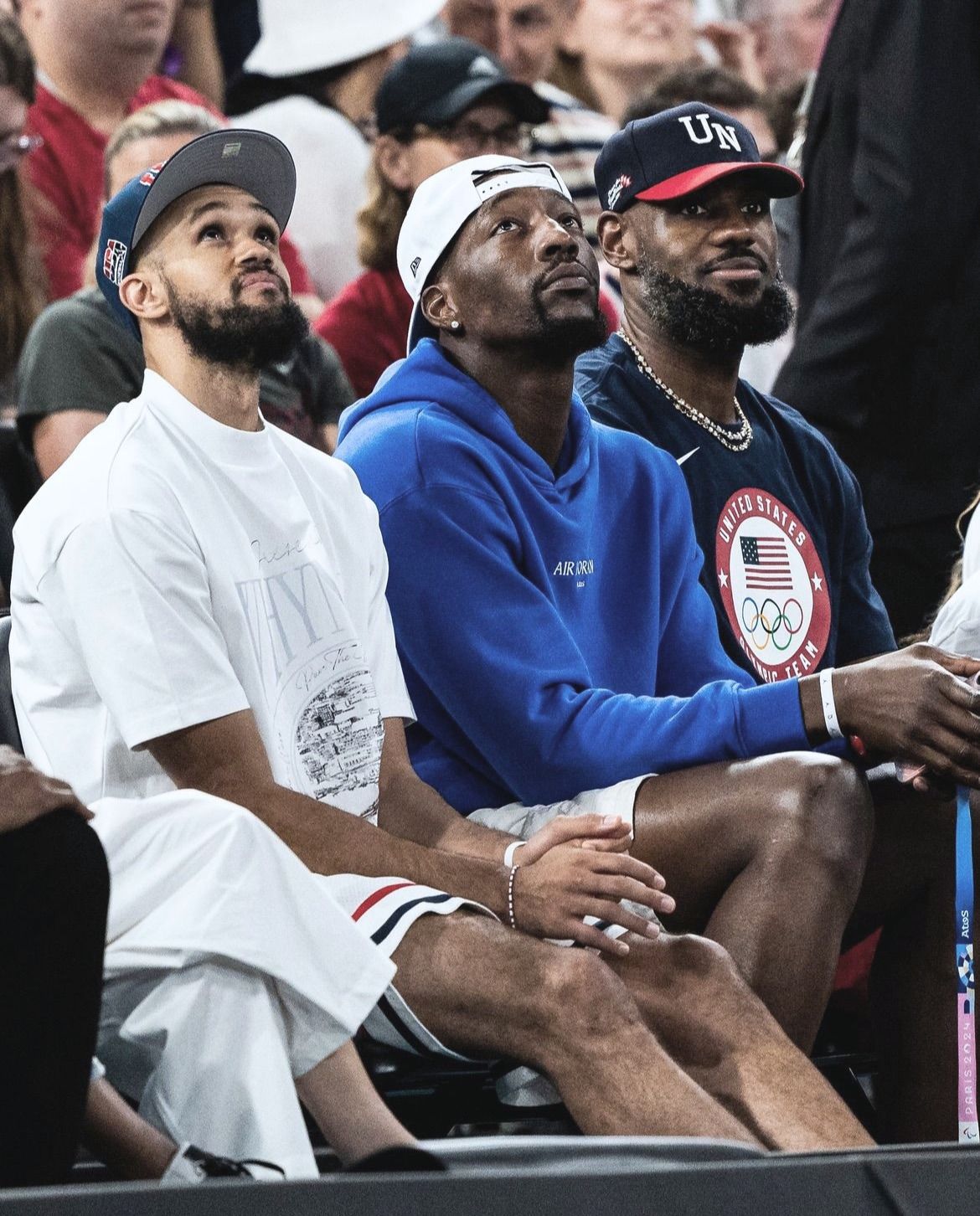 Derrick White courtside with LeBron James and Bam Adebayo at the Olympic gold medal women's game.